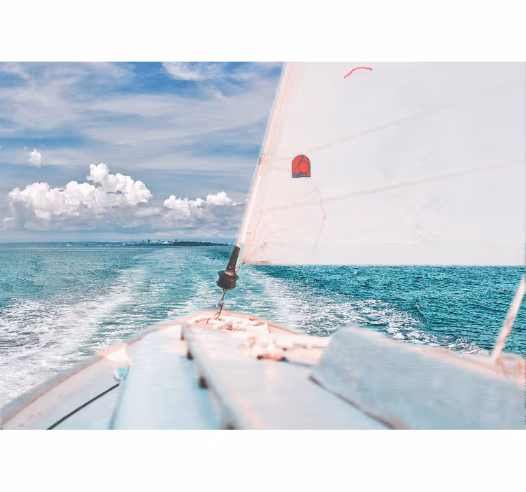Blue wall mural boat at sea with white clouds - TenStickers