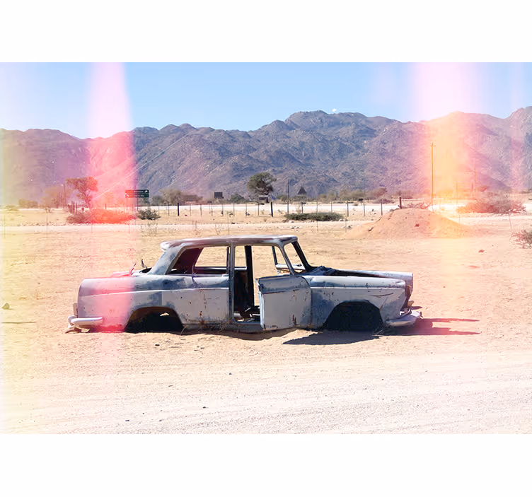Abandoned car in desert  wall mural - TenStickers