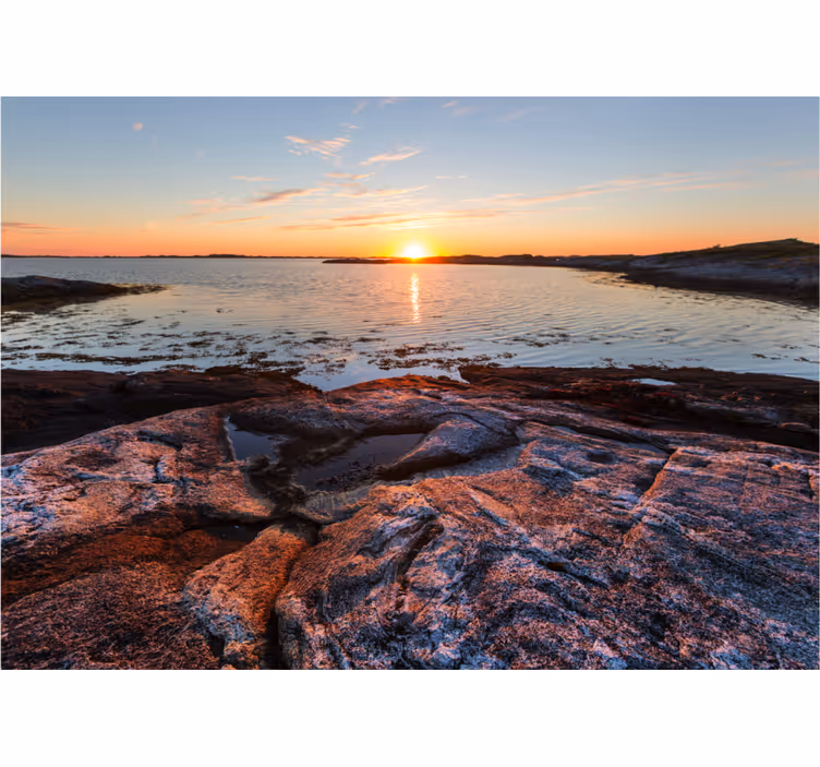Serene sunset over water landscape mural wallpaper - TenStickers