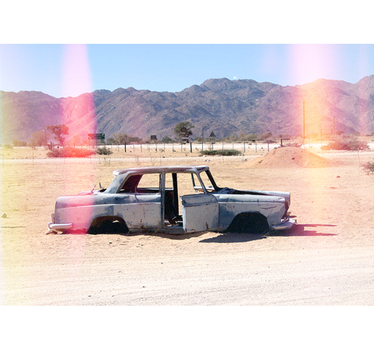 Abandoned car in desert  wall mural - TenStickers